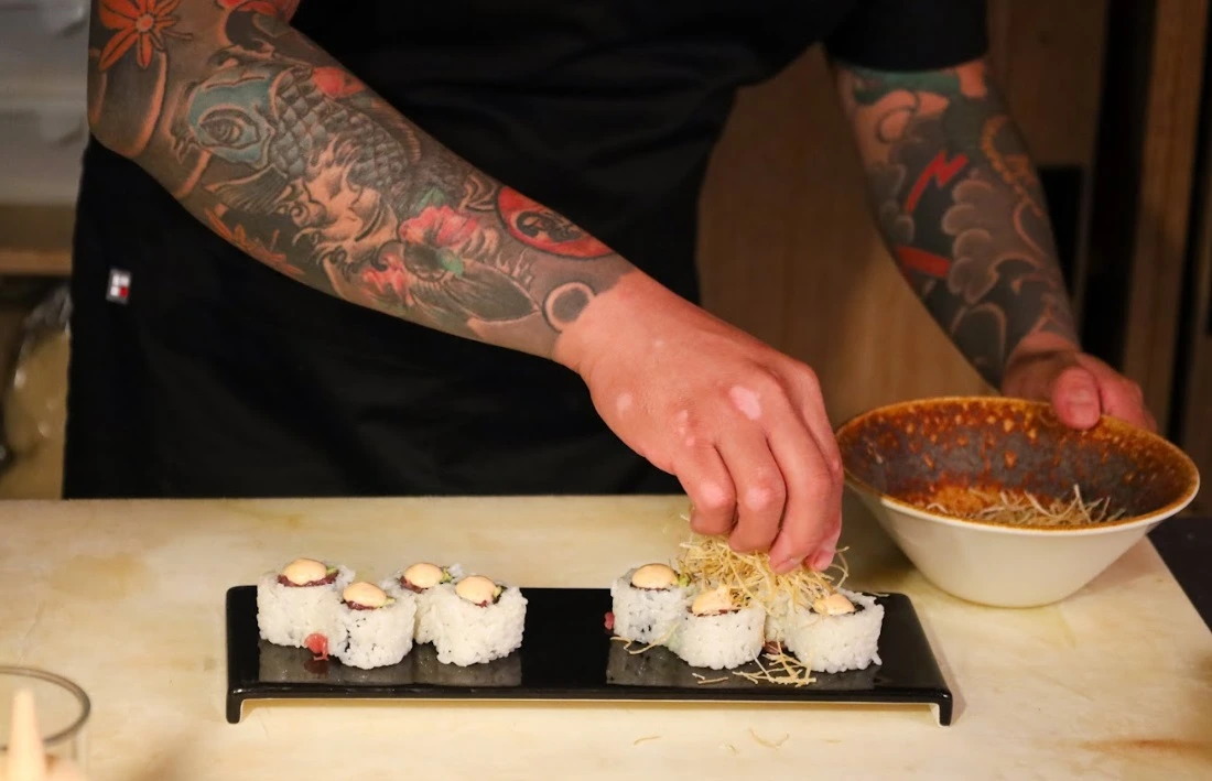 Chef preparing nigiri during the omakase experience at Tokoya Nigiri Bar