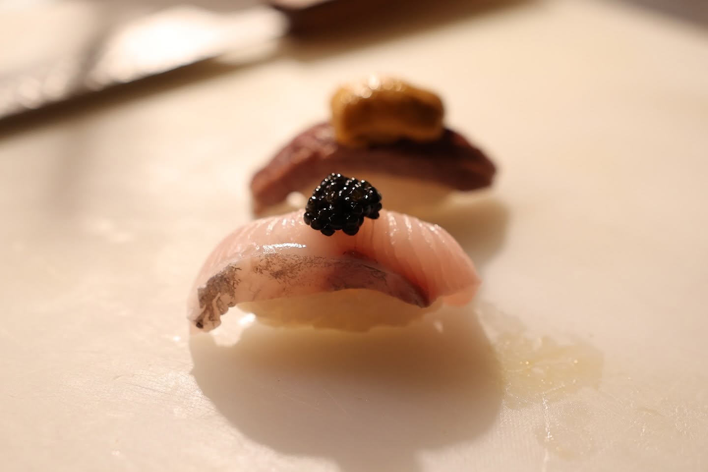 Seasonal Japanese fish served as sushi nigiri