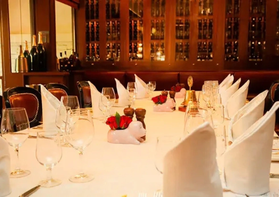 ● Private dining table set for an event beside the wine cellar at Au Pied de Cochon